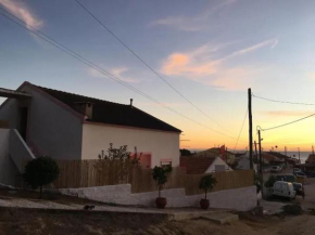 Pink Fisherman's Cabin on Fonte da Telha Beach | By Airnest